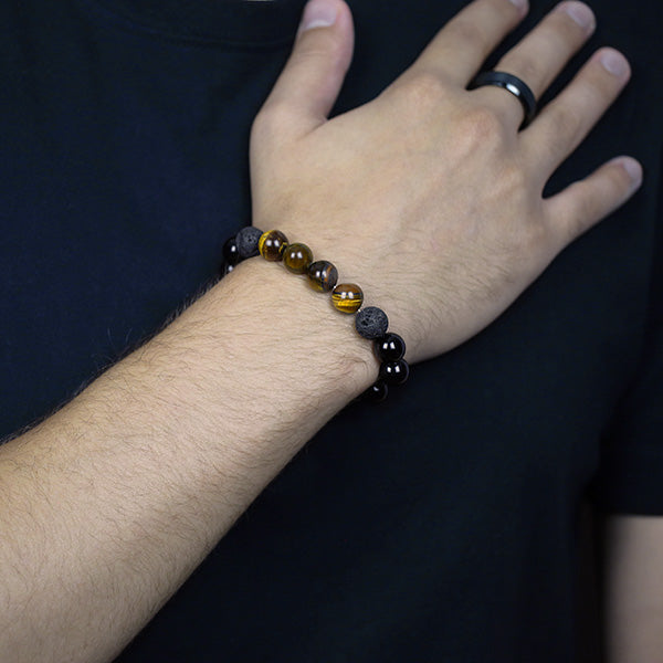 Black Onyx Bracelet featuring Lava Beads and Tiger Eye Worn by Man with Black Tungsten Carbide Ring